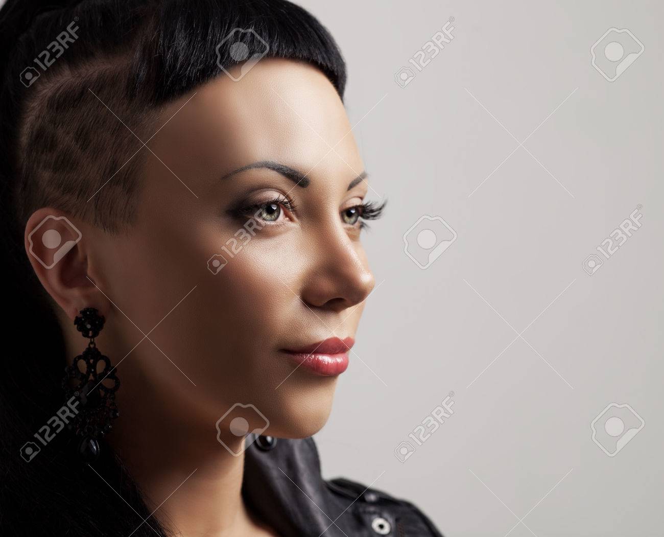 Woman With Modern Unusual Haircut With Shaved Sides And A Fringe