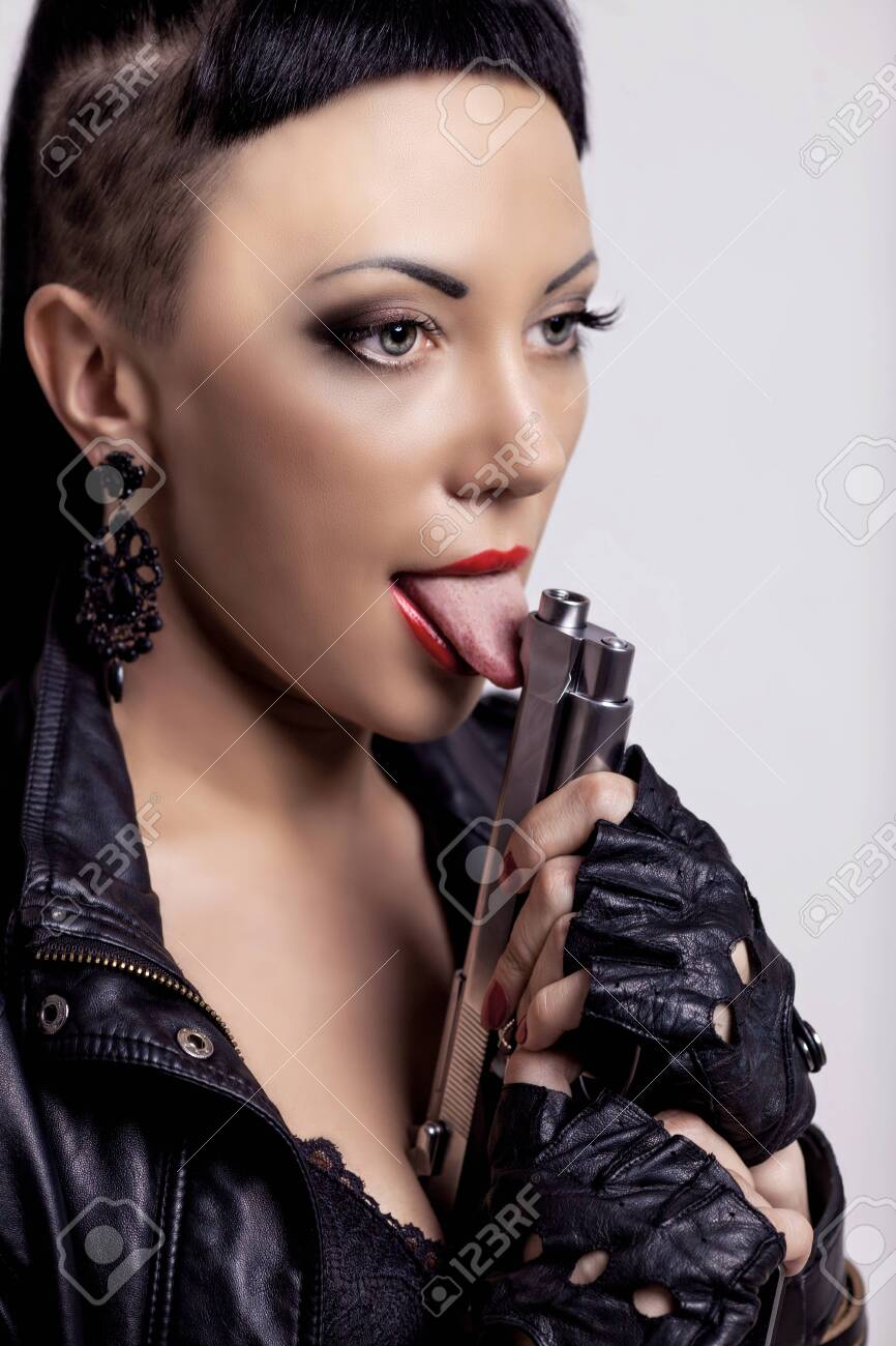 Woman With Modern Unusual Haircut With Shaved Sides And A Fringe