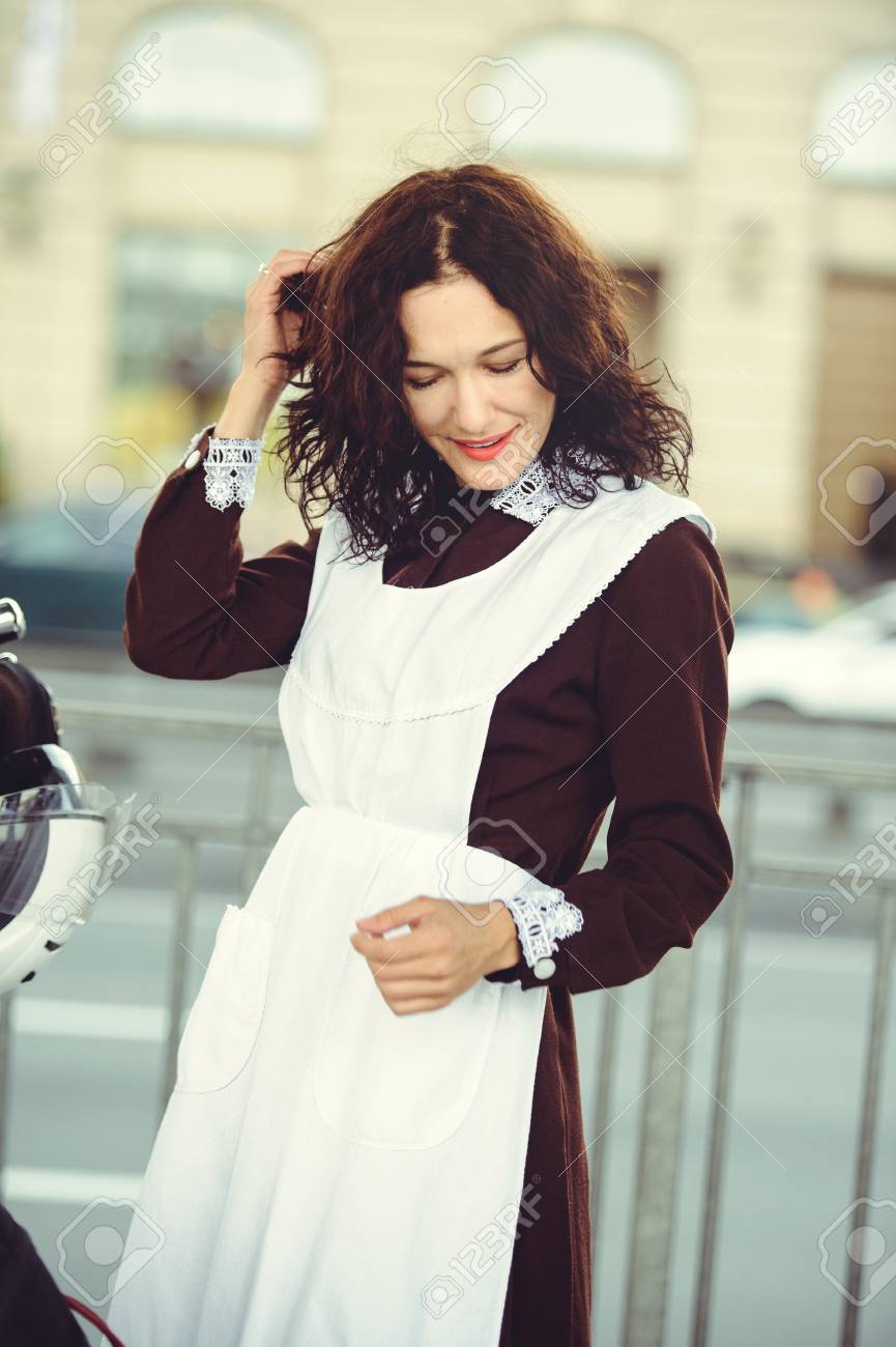 Beautiful Young Woman Hairstyle And Bows Outdoors With A