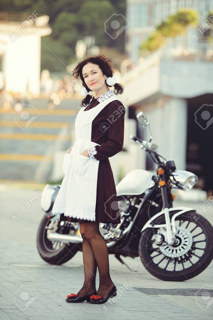 Beautiful Young Woman Hairstyle And Bows Outdoors With A