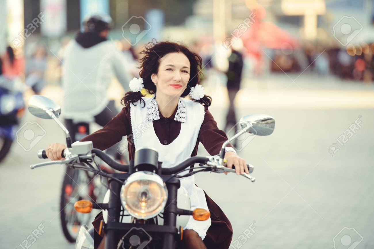 Beautiful Young Woman Hairstyle And Bows Outdoors With A