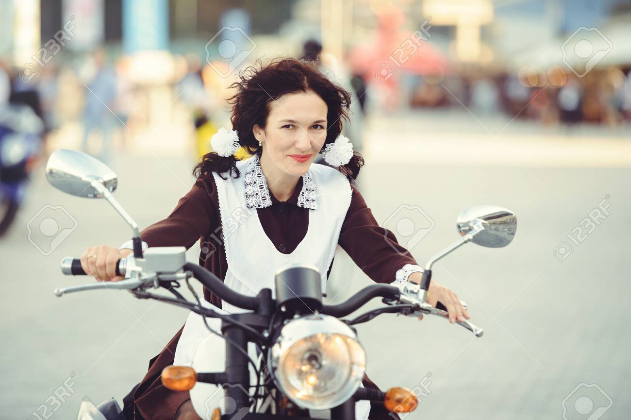 Beautiful Young Woman Hairstyle And Bows Outdoors With A