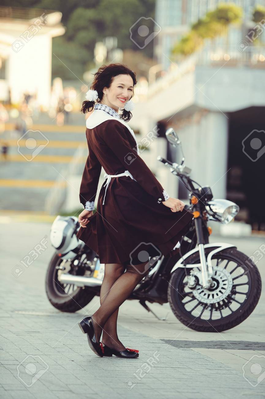 Beautiful Young Woman Hairstyle And Bows Outdoors With A