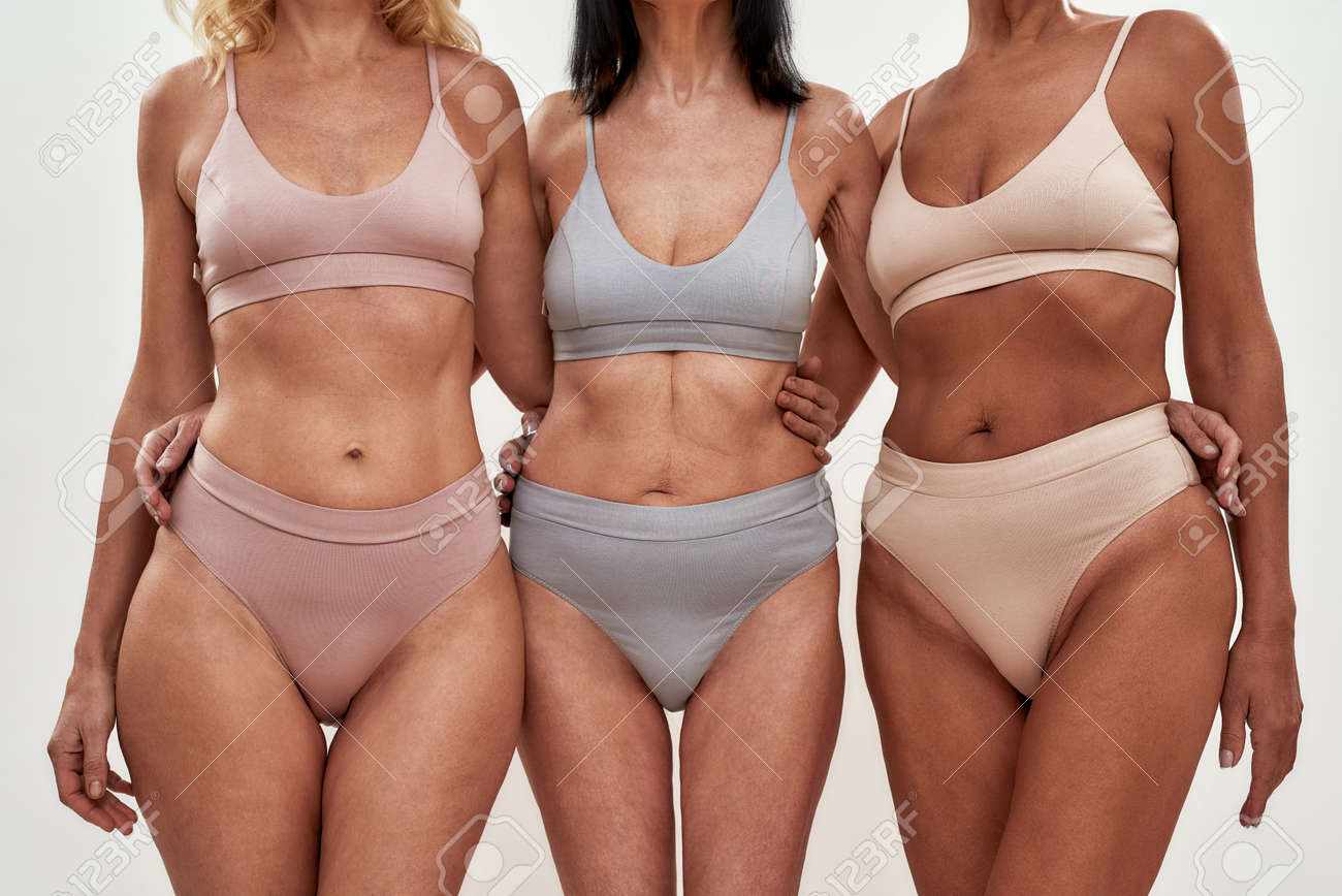Visitando El Spa Juntos. Captura Recortada Tres Mayores En Ropa Interior Abrazándose Mientras Posan Contra Fondo Claro Fotos, Retratos, Imágenes Y Fotografía De Archivo Libres De Derecho. Image 165316438.