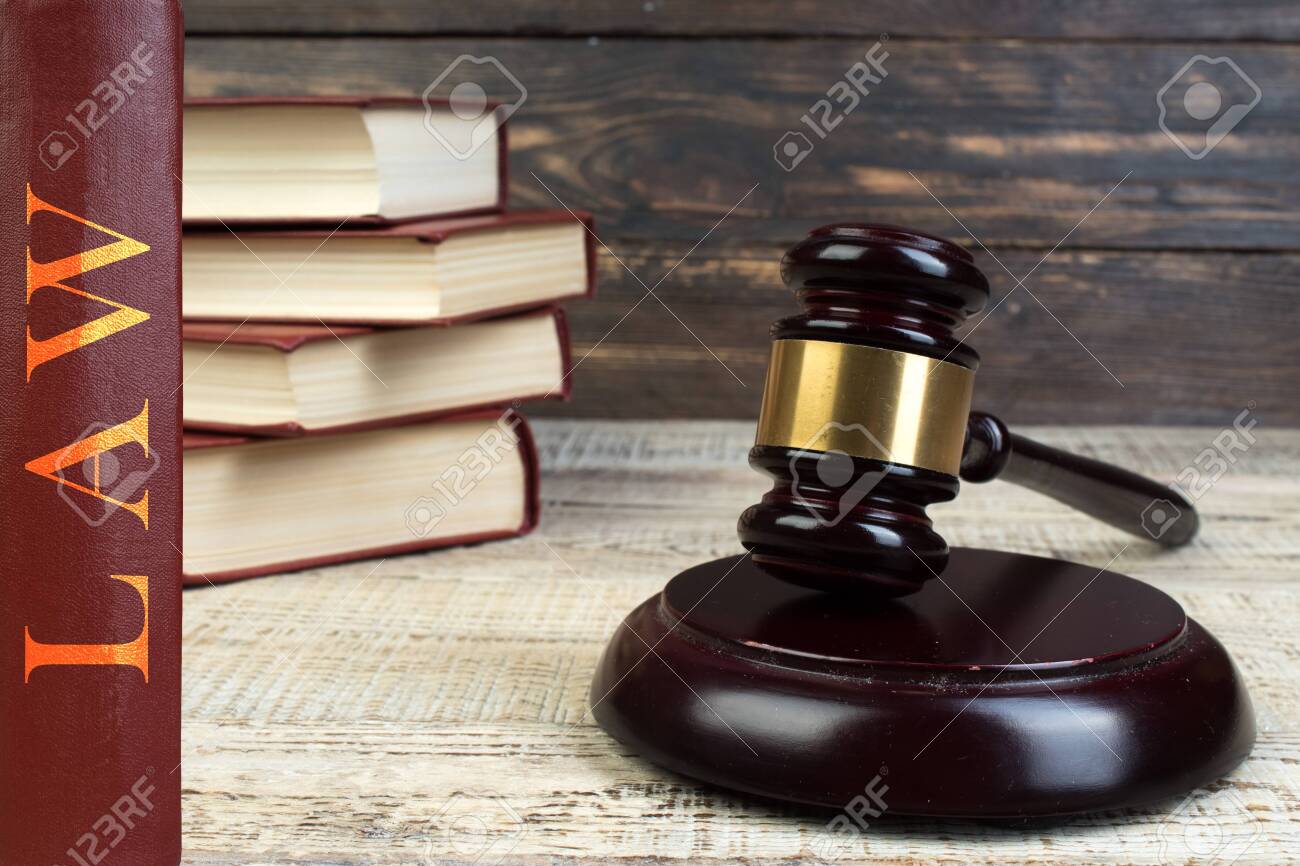 Law and Justice, Legality concept, Judge Gavel on a wooden background, Law library concept. - 124005303 Law and Justice, Legality concept, Judge Gavel on a wooden background, Law library concept. - 124005303
