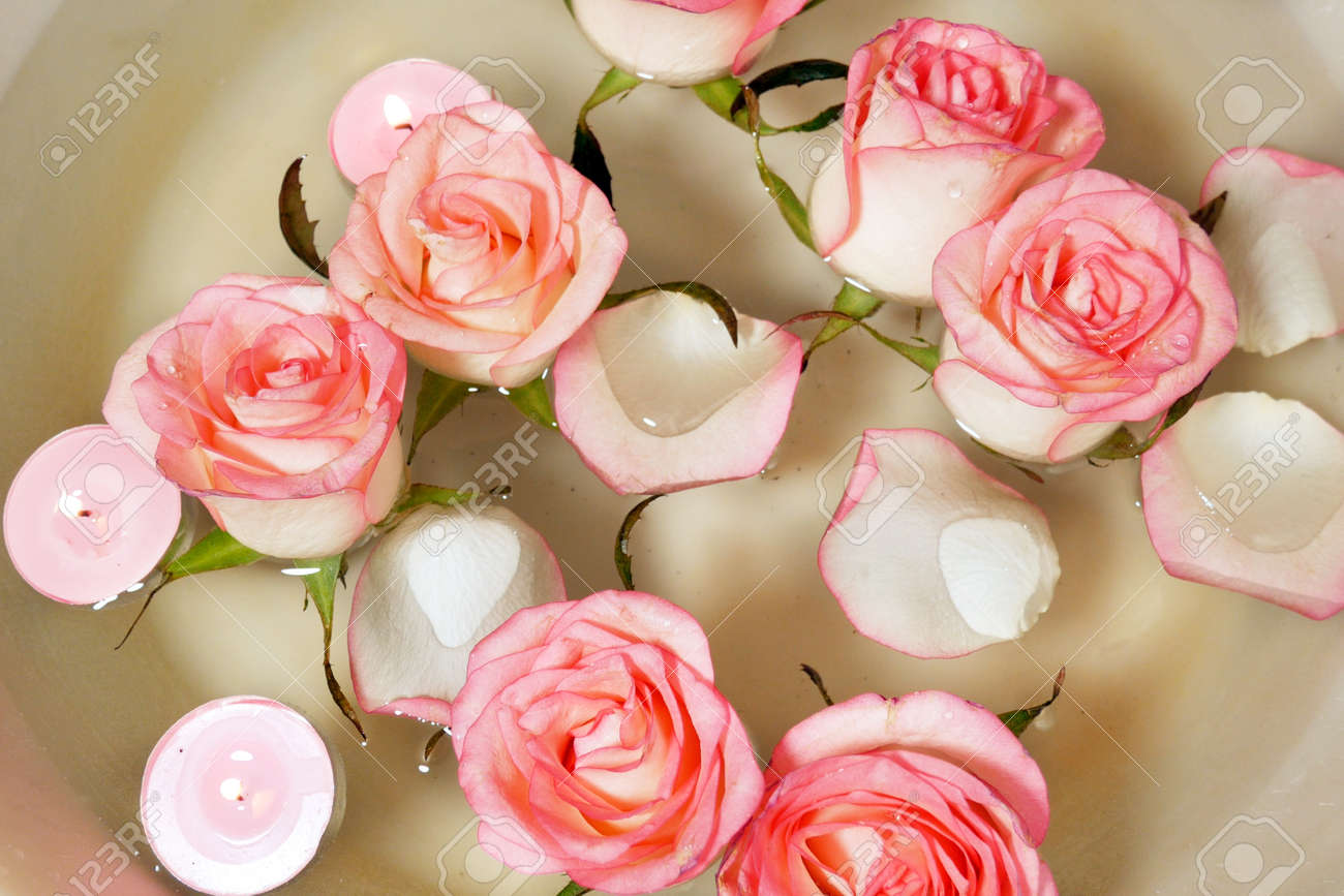 Pink rose, candles and petal floating water in bowl. Relaxing Hand Spa closeup - 157023675 Pink rose, candles and petal floating water in bowl. Relaxing Hand Spa closeup - 157023675