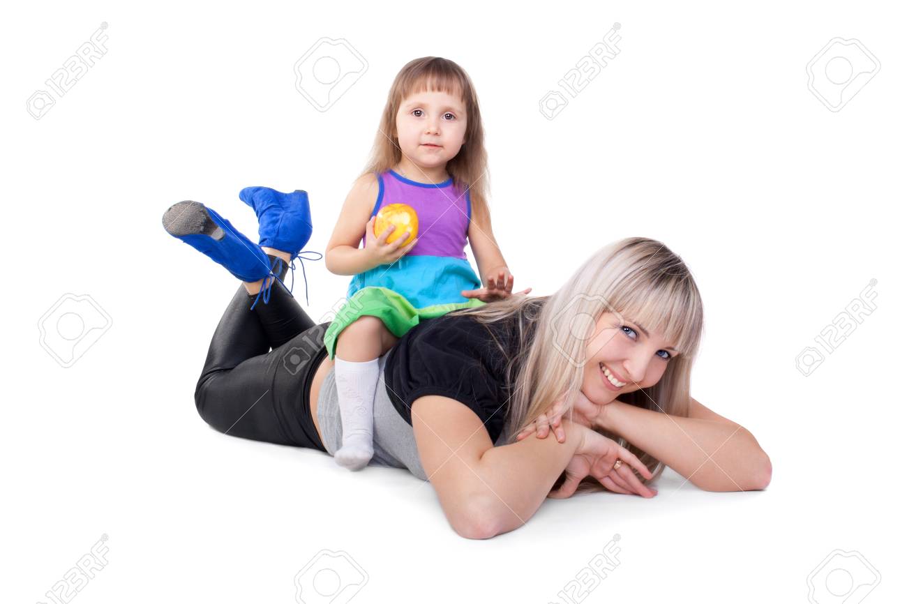 Cute Little Child Sitting On Her Mother S Back And Eating Apple Stock Photo Picture And Royalty Free Image Image