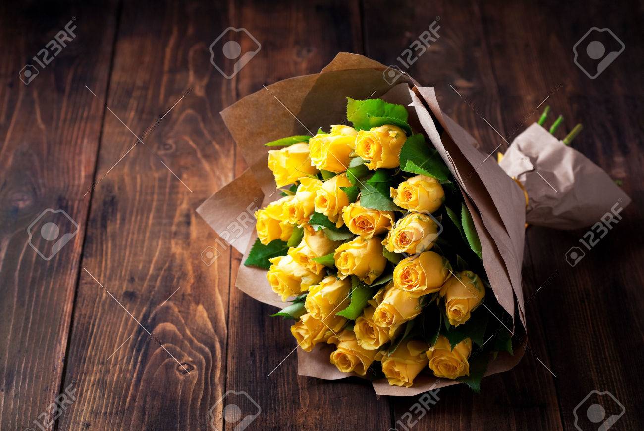 Download Yellow Roses Bouquet In Kraft Paper On A Wooden Background Selective Stock Photo Picture And Royalty Free Image Image 51499513 Yellowimages Mockups
