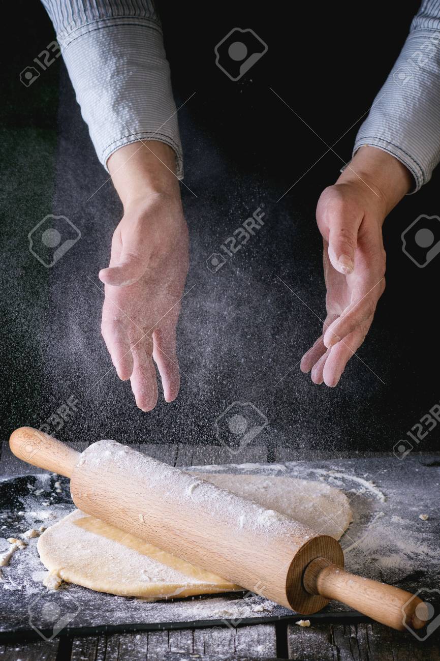 Dark Rustic Style Female Hands Powdered By Flour Rolled Out Dough For Pasta With Wooden Rolling Pin Over Dark Rustic Style Female Hands Powdered By Flour Rolled Out Dough For Pasta With Wooden Rolling Pin Over