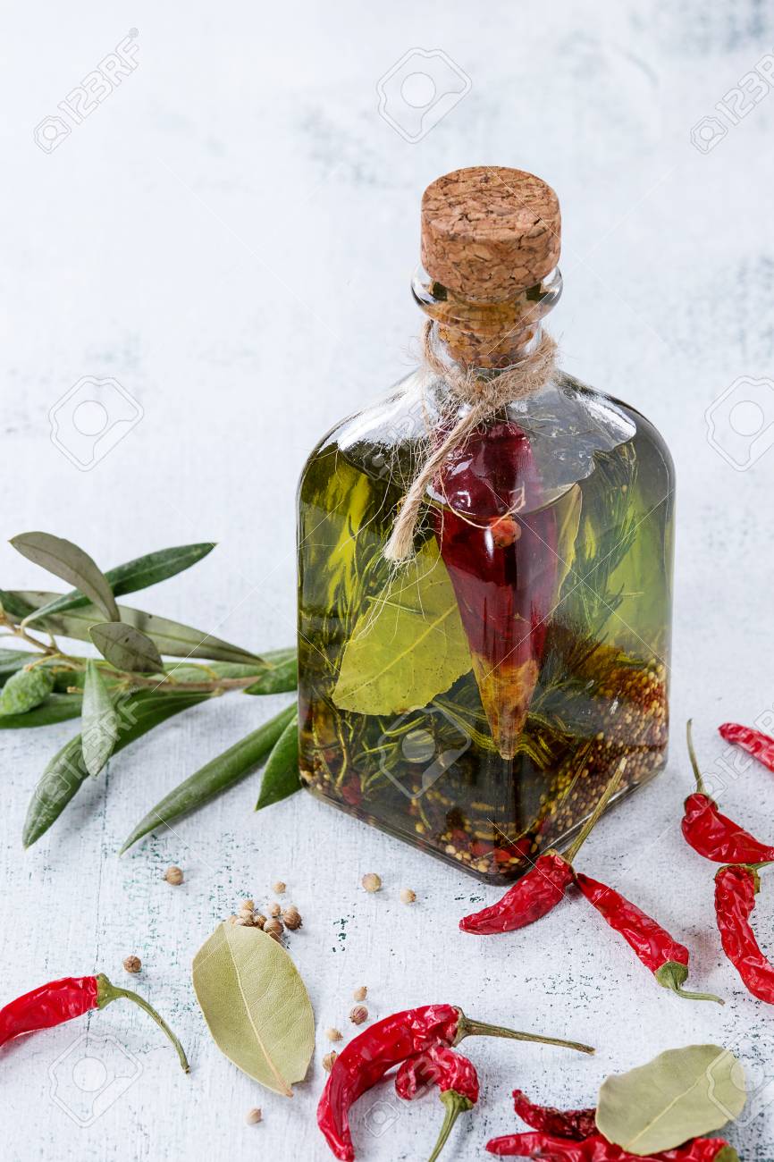Glass Bottle Of Spicy Olive Oil With Rosemary Red Hot Chili Stock Photo Picture And Royalty Free Image Image 65353994