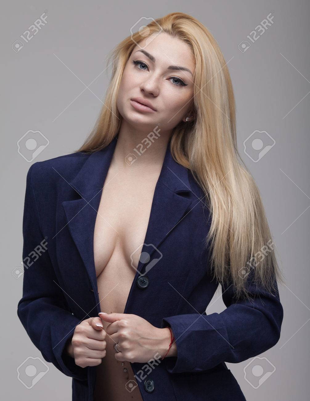 Sexy Blonde Business Lady Wearing Blue Suit .big Lips And Boobs. Stock  Photo, Picture and Royalty Free Image. Image 70226968.