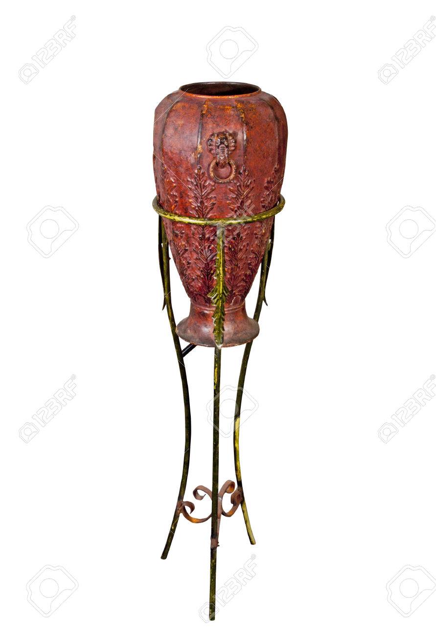 Decorative Vase Supported By Three Legged Metal Stand Stock Photo