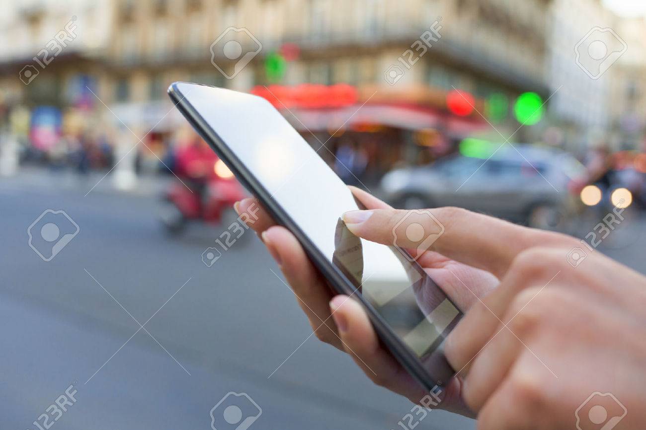 Woman using mobile phone on the street in Paris - 33640145 Woman using mobile phone on the street in Paris - 33640145