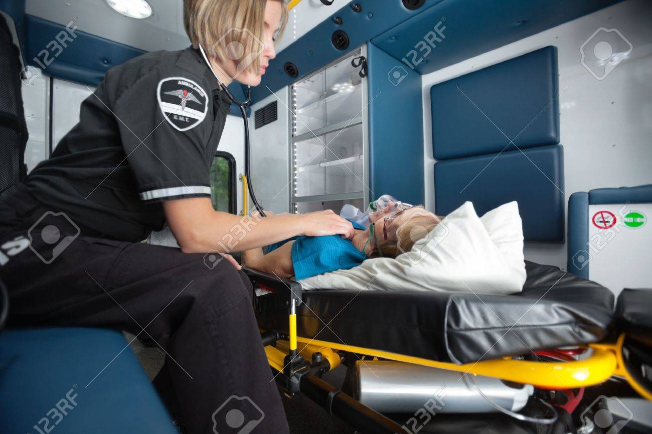 Senior woman receiving emergency medical care in ambulance - 10789800 Senior woman receiving emergency medical care in ambulance - 10789800