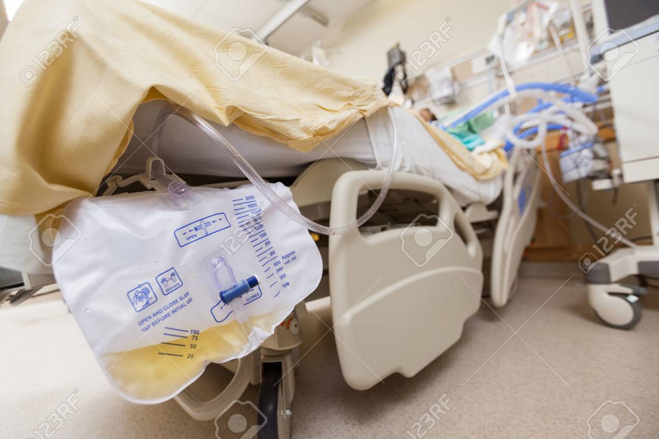 Closeup of urine bag attached to bed in hospital - 23711268 Closeup of urine bag attached to bed in hospital - 23711268