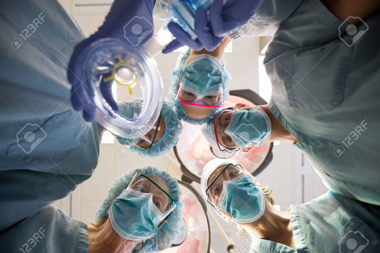 Directly Below Portrait Of Surgeons With Oxygen Mask In Operation Room  Stock Photo, Picture And Royalty Free Image. Image 25769202.