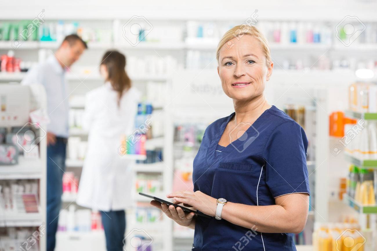 portrait of confident assistant holding tablet computer while customer assistant