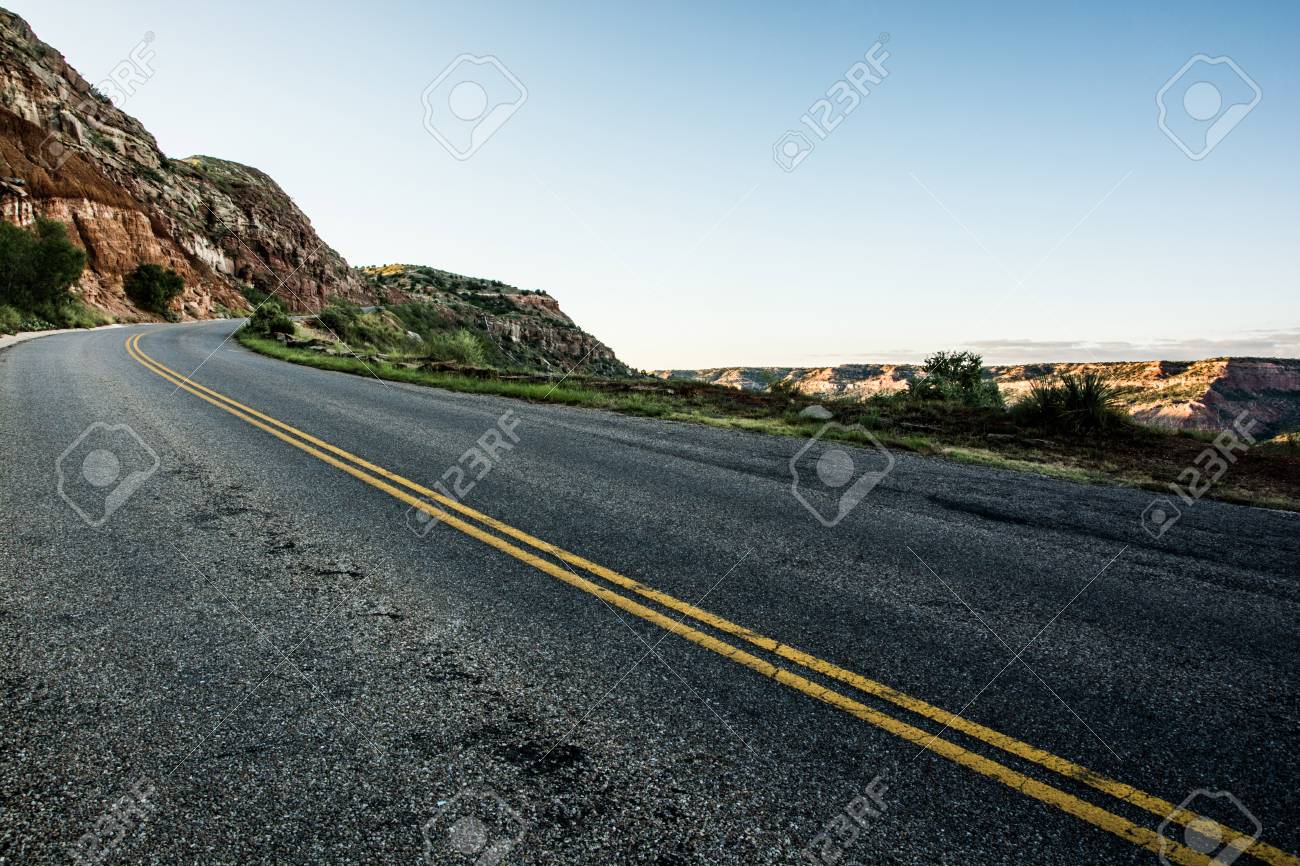 Driving On Open Road Towards The Mountain At Dawn Stock Photo - Download  Image Now - Desert Area, In Front Of, Mountain - iStock, image size:1300x866