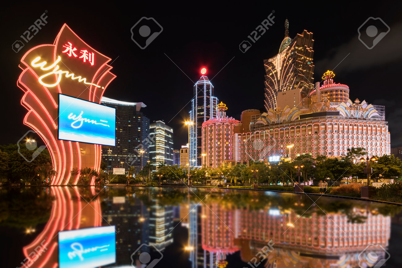 MACAU, CHINA - JUNE 30, 2016: Wynn Casino and Grand Casino Lisboa on June 30, 2016 in Macau. Macau is the world's top casino market and Casino Lisboa is one of the most well known casinos in the city. - 91068478 MACAU, CHINA - JUNE 30, 2016: Wynn Casino and Grand Casino Lisboa on June 30, 2016 in Macau. Macau is the world's top casino market and Casino Lisboa is one of the most well known casinos in the city. - 91068478