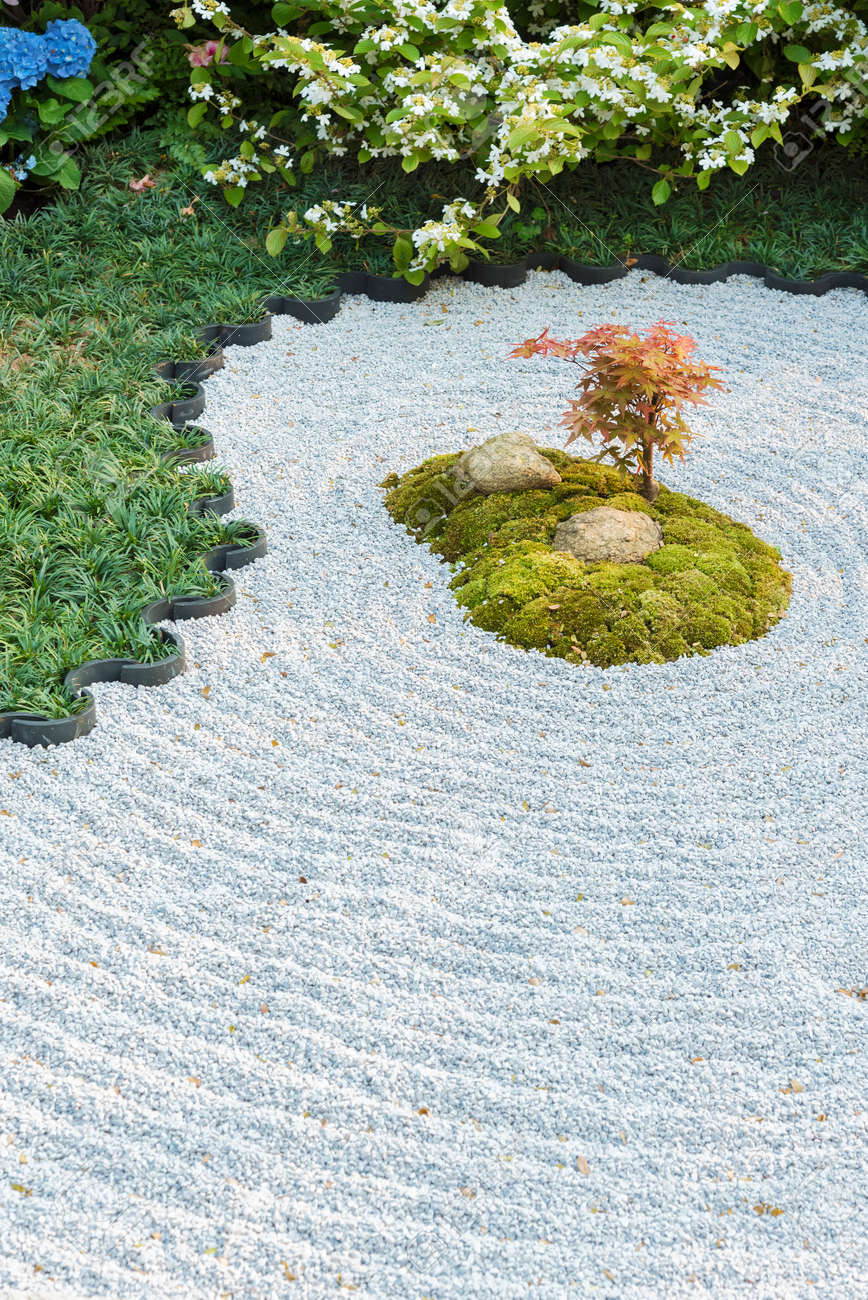 Japanese Zen Garden With Plant, Stone In Raked Sand Stock Photo, Picture  and Royalty Free Image. Image 168646718., image size:868x1300