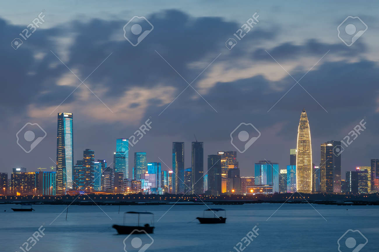Skyline of Shenzhen city, China at night. Viewed from Hong Kong border Lau Fau Shan - 171283885 Skyline of Shenzhen city, China at night. Viewed from Hong Kong border Lau Fau Shan - 171283885