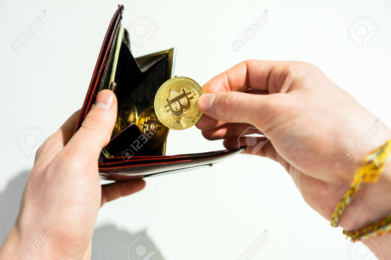 Bitcoin Gold Coin In Leather Wallet. Bitcoin In The Hands Of A Man. Stock  Photo, Picture and Royalty Free Image. Image 163891288.