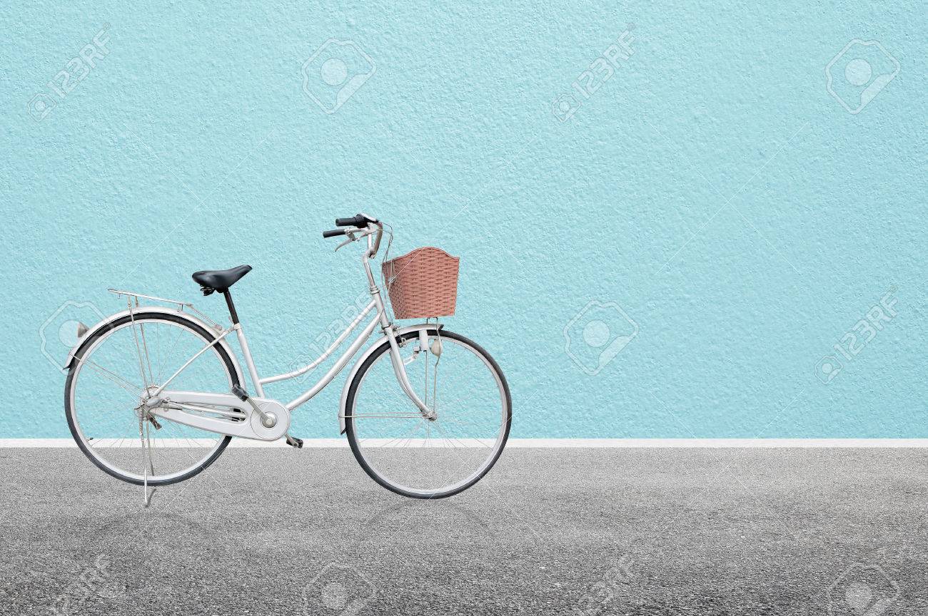 Bicycle on road and blue wall abstract background , retro vintage style - 64626362 Bicycle on road and blue wall abstract background , retro vintage style - 64626362