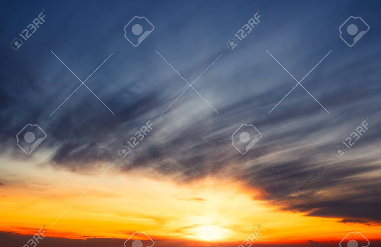 Winter sky at sunset in Madrid,Spain. Orange and blue colors - 138669714 Winter sky at sunset in Madrid,Spain. Orange and blue colors - 138669714