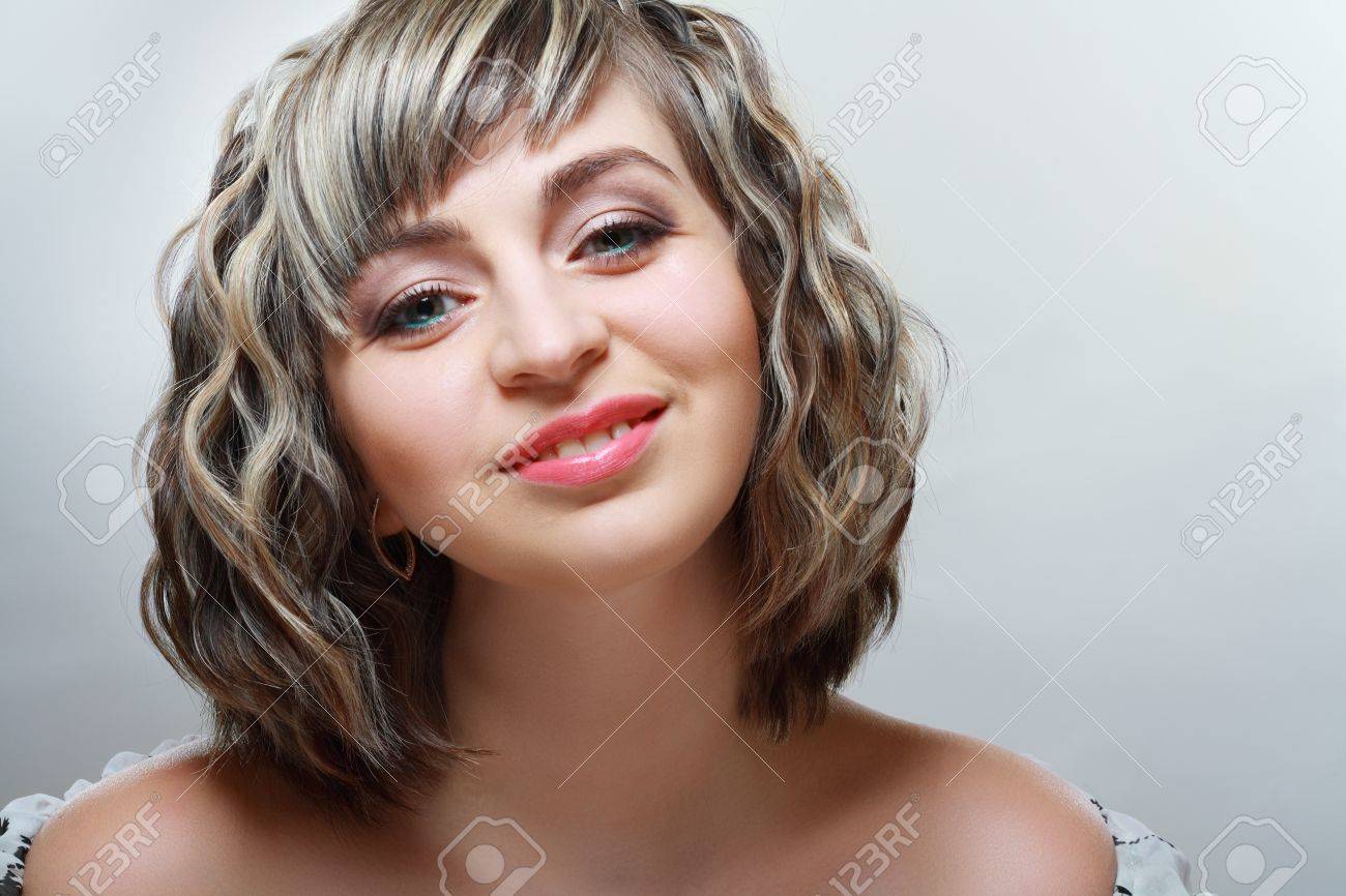Beautiful Woman With Short Hair Style Close Up Over Light Grey