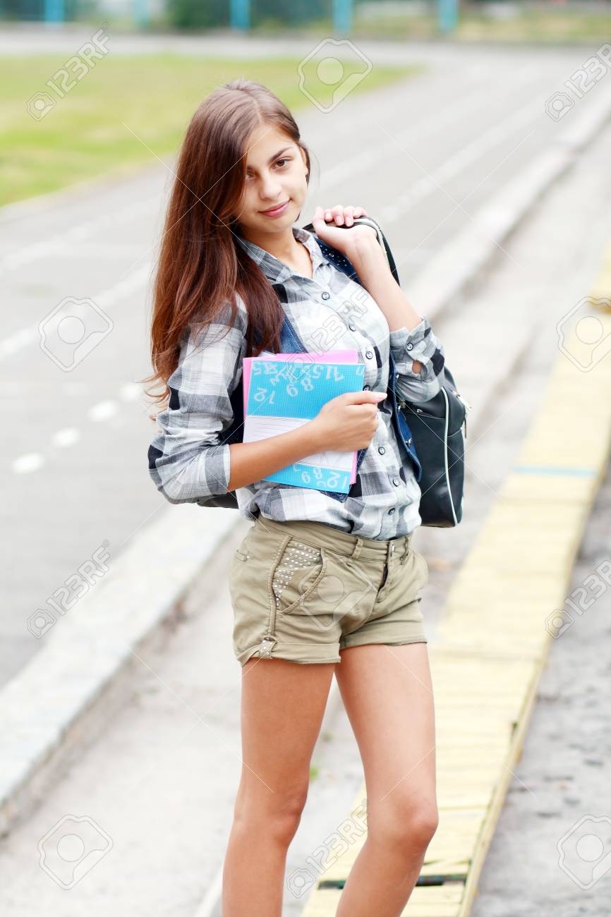 Back To School Teen Girl Outdoor On The School Stadion Going To Study Stock Photo Back To School Teen Girl Outdoor On The School Stadion Going To Study Stock Photo