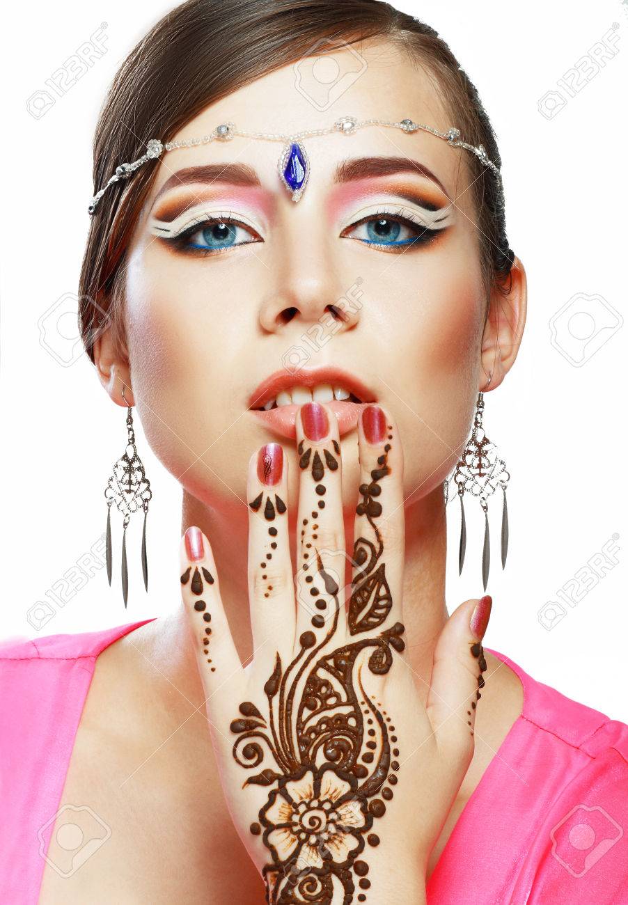 Beautiful Girl Face With Perfect Arabian Make Up With Hand With Detail Of Henna Being Applied Beautiful Girl Face With Perfect Arabian Make Up With Hand With Detail Of Henna Being Applied