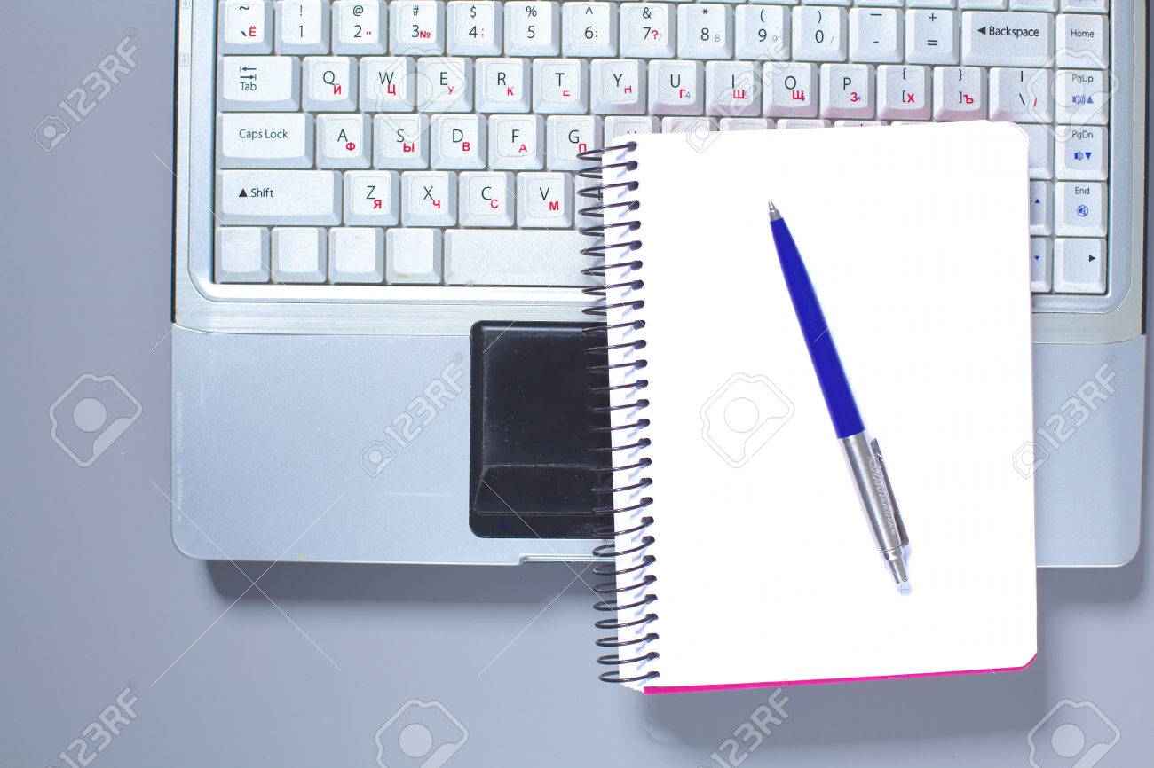 a note book laptop pen graph paper document on the office stock office graph paper