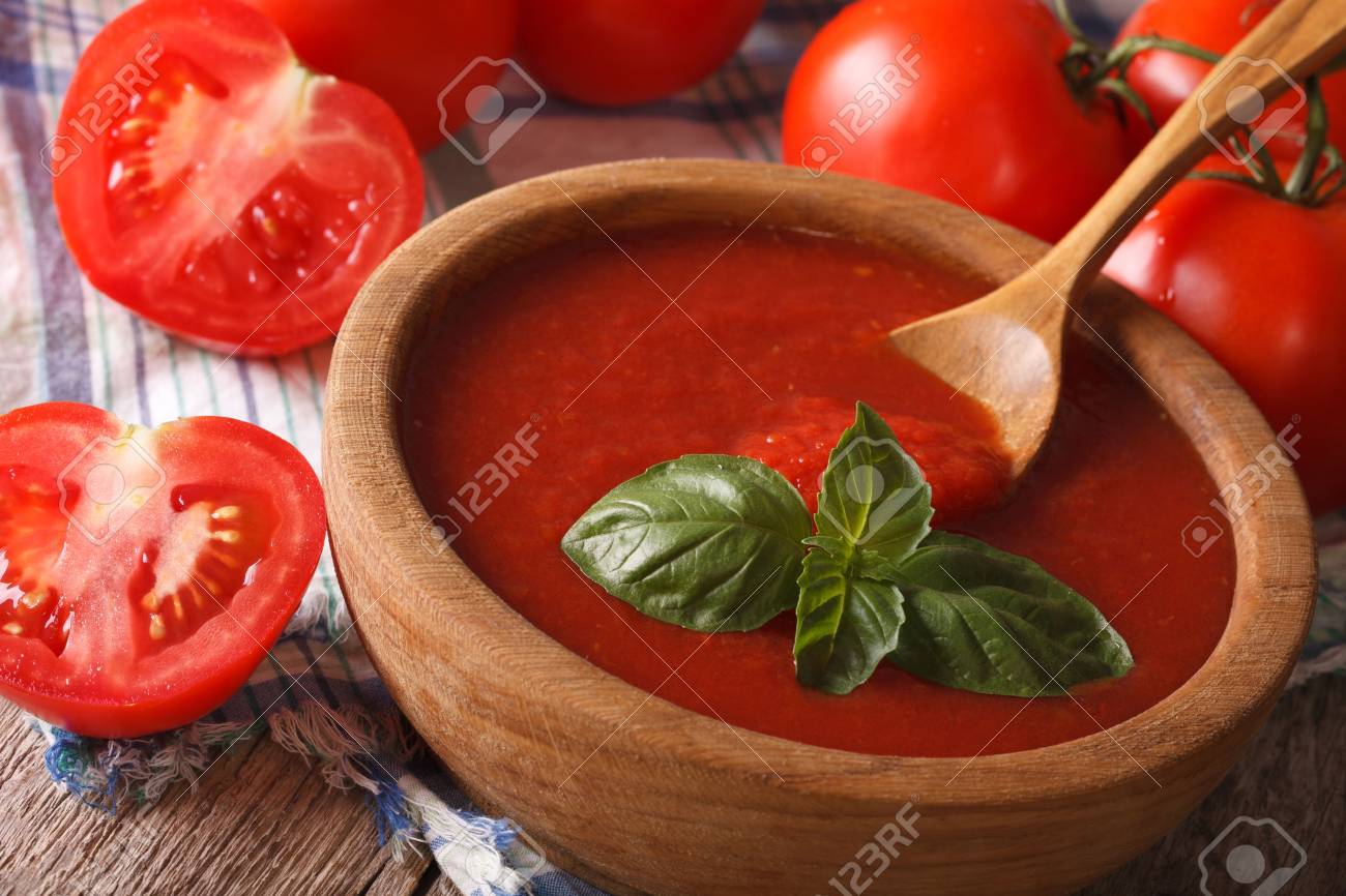 Fresh red tomato sauce with basil in a wooden bowl closeup. Horizontal - 45030638 Fresh red tomato sauce with basil in a wooden bowl closeup. Horizontal - 45030638