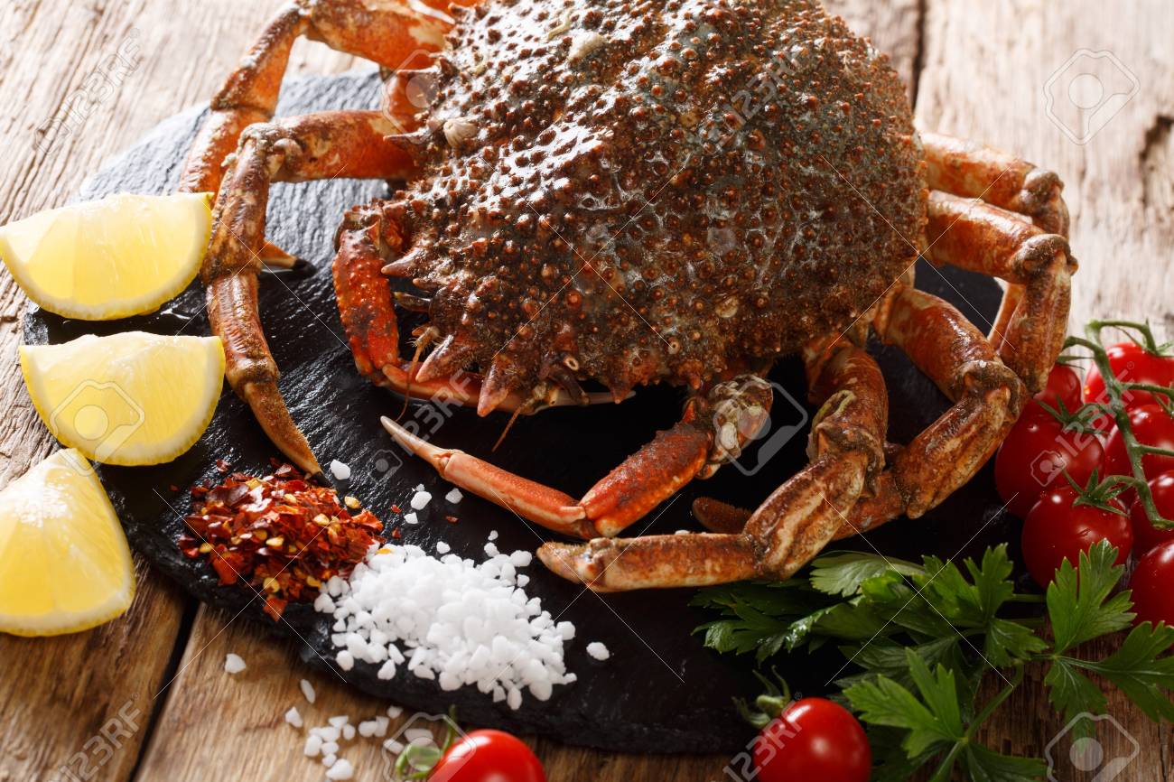 106915425-gourmet-food-raw-spider-crab-with-ingredients-for-cooking-close-up-on-a-wooden-table-horizontal.jpg