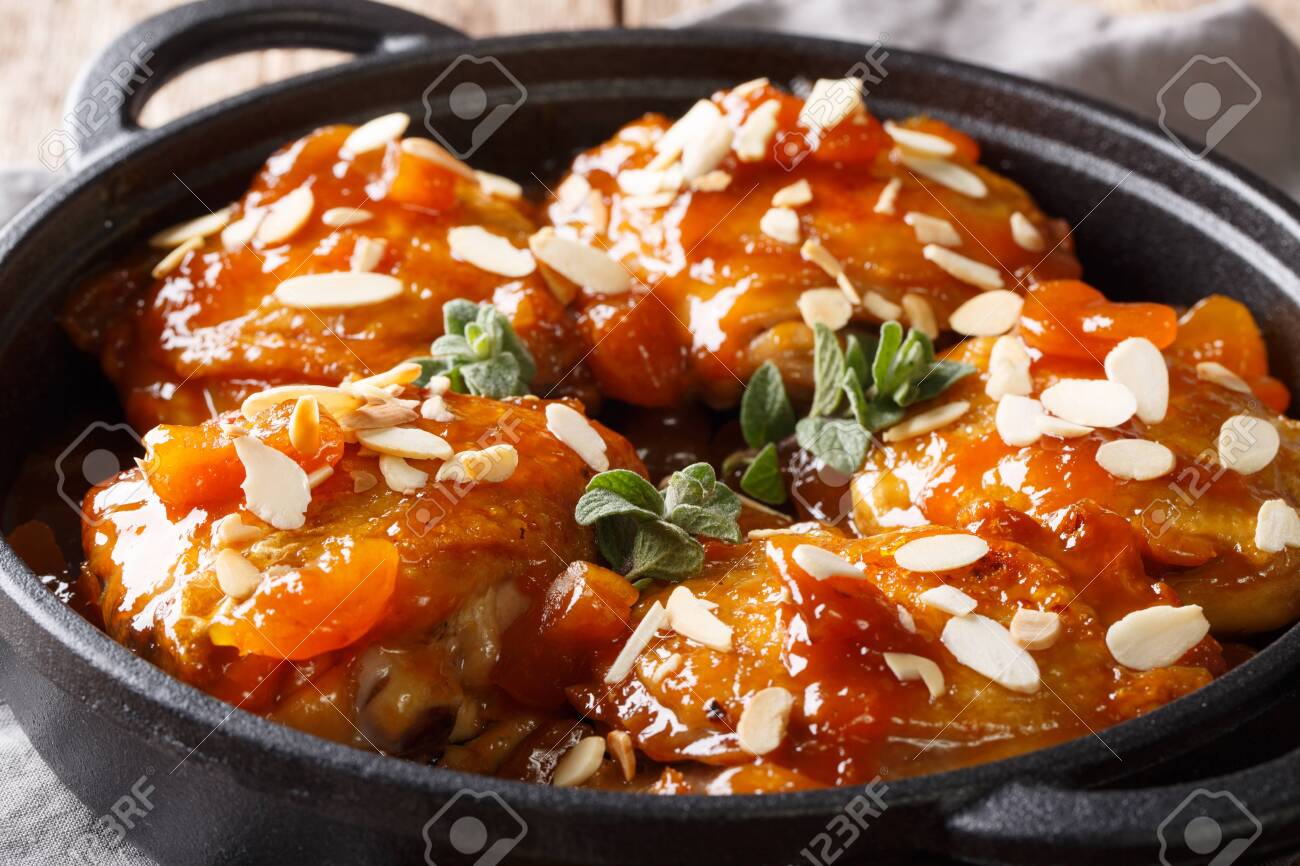 Tender Sticky Chicken Thighs With Apricot Glaze And Almond Flakes Stock Photo Picture And Royalty Free Image Image 116481332