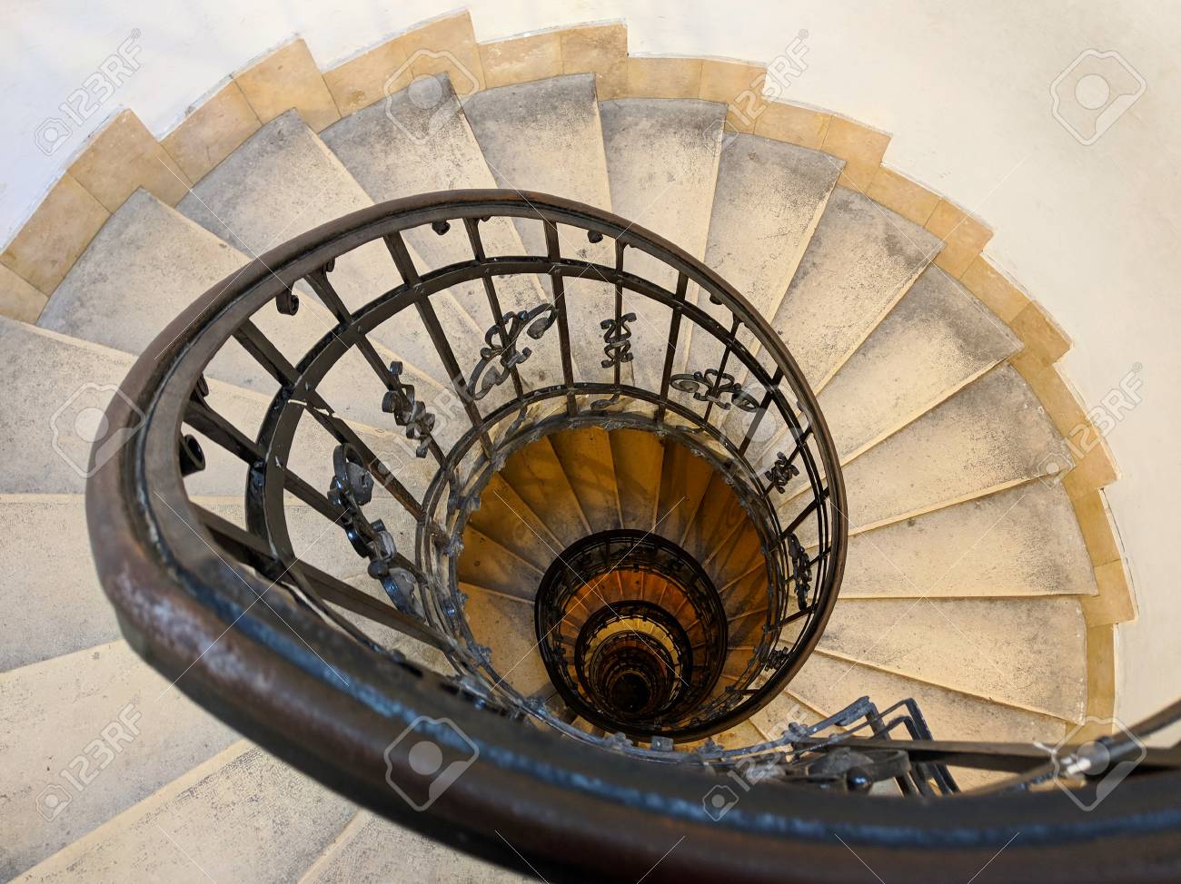 indoor spiral staircase enclosed stock photo upside view of indoor spiral staircase with metal ornamental handrail architectural detail in st stephens basilica budapest hungary view of indoor spiral staircase with metal ornamental indoor spiral staircase enclosed stock photo upside view of indoor spiral staircase with metal ornamental handrail architectural detail in st stephens basilica budapest hungary view of indoor spiral staircase with metal ornamental