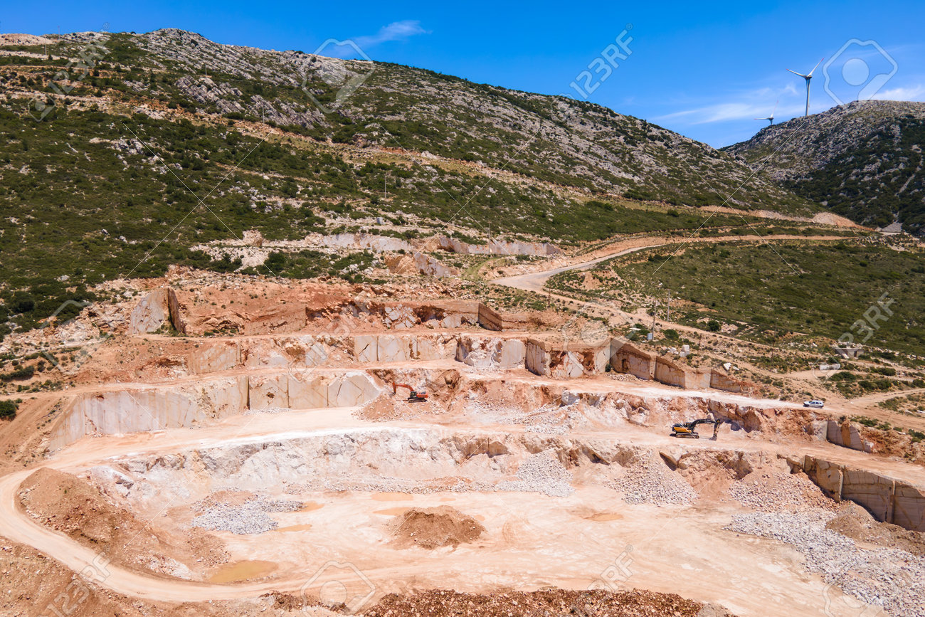 https://previews.123rf.com/images/leonidsorokin/leonidsorokin2308/leonidsorokin230800026/210277589-aerial-view-of-the-extraction-of-marble-in-the-quarry-in-turkey-open-pit-mine.jpg