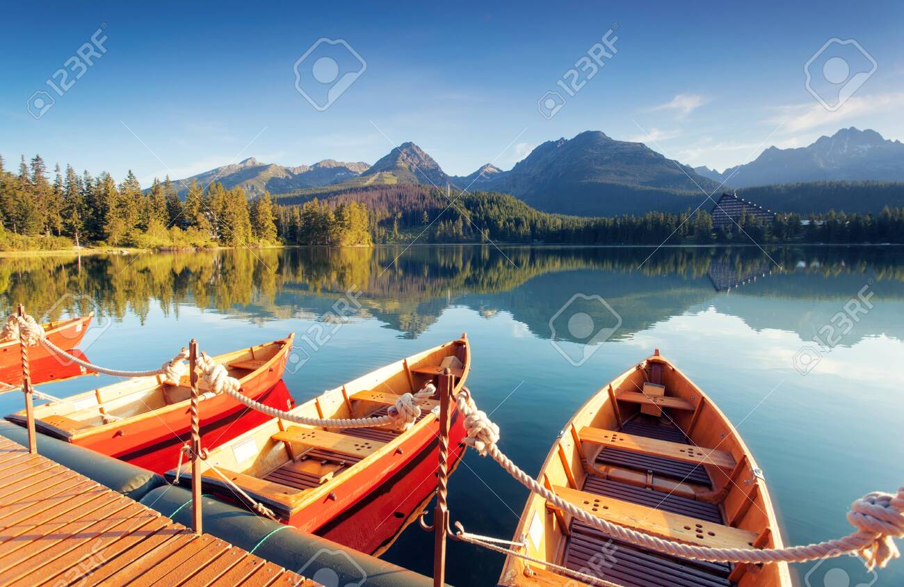 Beautiful mountain lake in National Park High Tatra. Location Strbske pleso, Slovakia, Europe. Amazing landscape of popular tourist attraction. Summer scene. Discover the beauty of earth. - 147222996 Beautiful mountain lake in National Park High Tatra. Location Strbske pleso, Slovakia, Europe. Amazing landscape of popular tourist attraction. Summer scene. Discover the beauty of earth. - 147222996