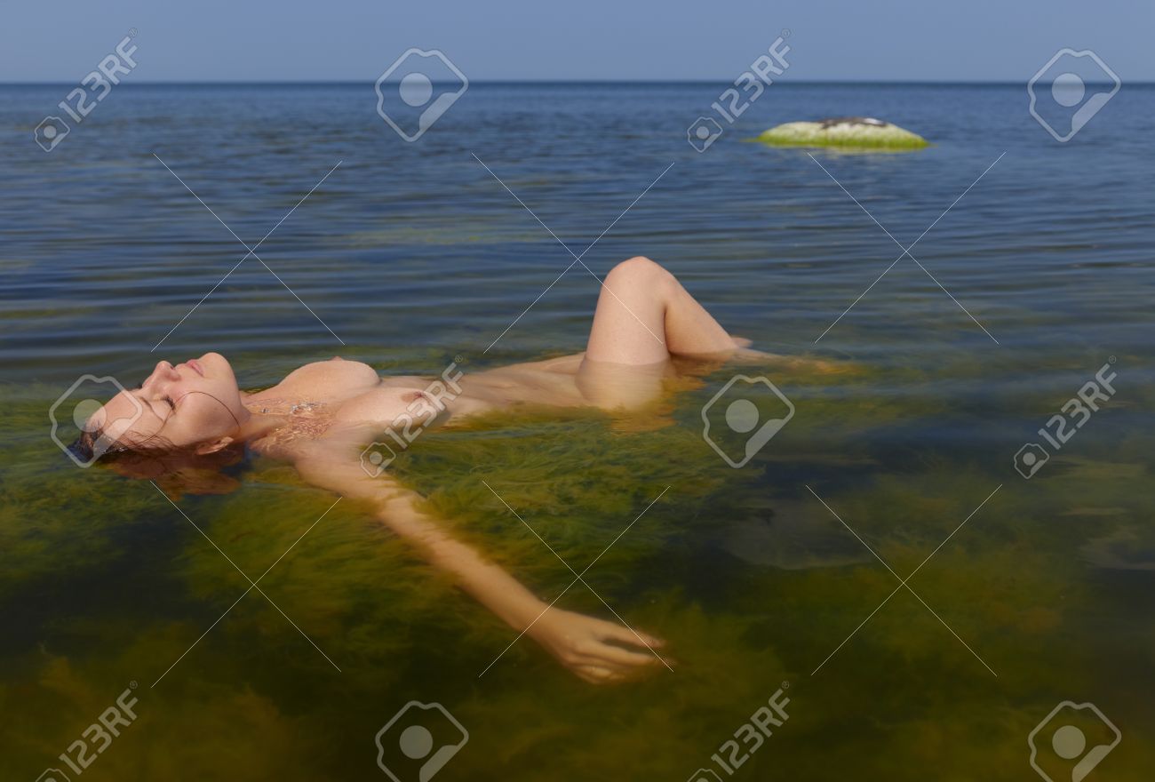 Porn nude girl covered in water