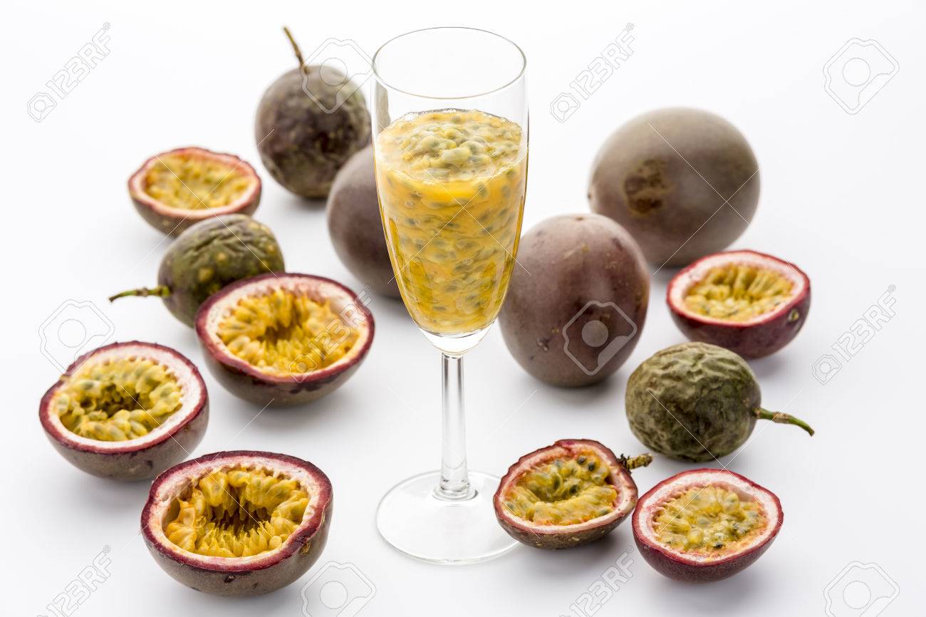 Yellow Passion Fruit Flesh, Juice And Seeds In A Champagne Flute ... Yellow Passion Fruit Flesh, Juice And Seeds In A Champagne Flute ...