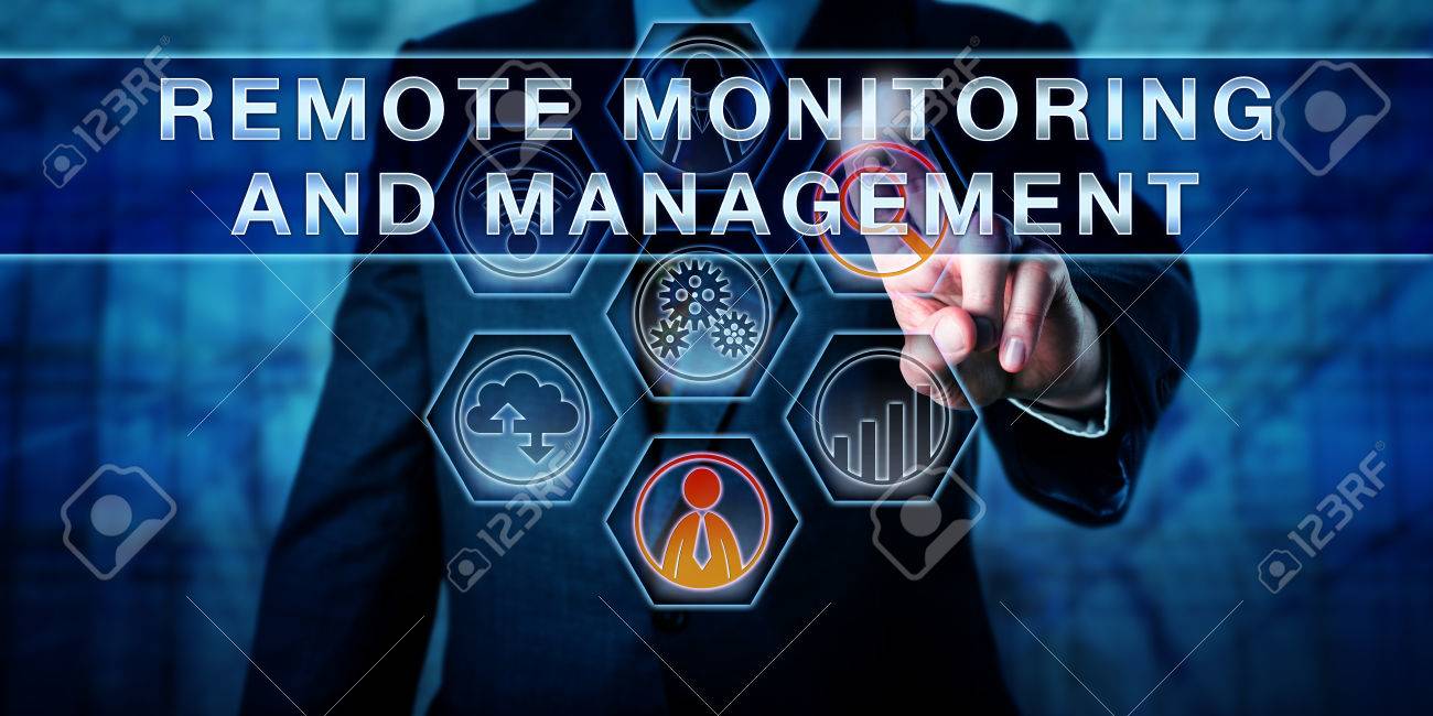 Male corporate business administrator in blue is pushing REMOTE MONITORING AND MANAGEMENT on an interactive control screen. Remote administration software concept. Industry term abbreviated as RMM. - 60776691 Male corporate business administrator in blue is pushing REMOTE MONITORING AND MANAGEMENT on an interactive control screen. Remote administration software concept. Industry term abbreviated as RMM. - 60776691
