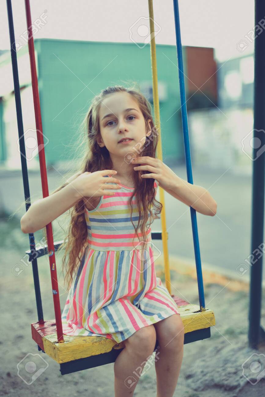 Swing Ride Swinging Girl Girl Riding A Swing A Girl Of 9 Stock Photo Picture And Royalty Free Image Image
