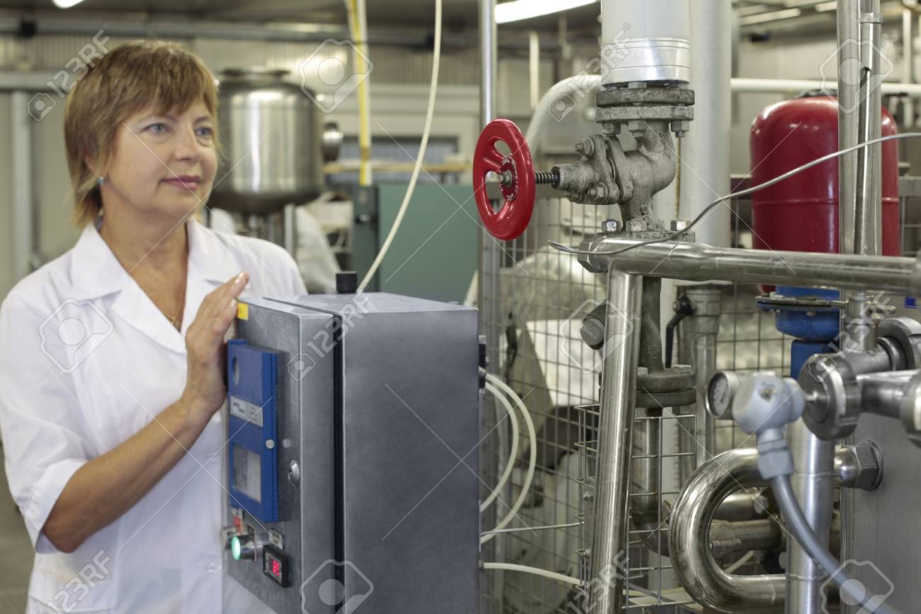 worker on a modern milk factory - 26030634 worker on a modern milk factory - 26030634