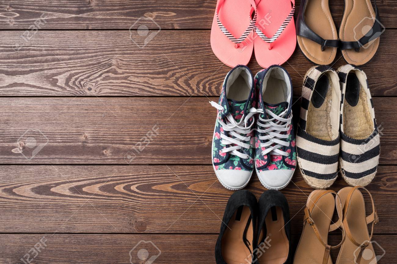 Collection Of Women's Shoes On Wooden Background Stock Photo, Picture And  Royalty Free Image. Image 76679372.