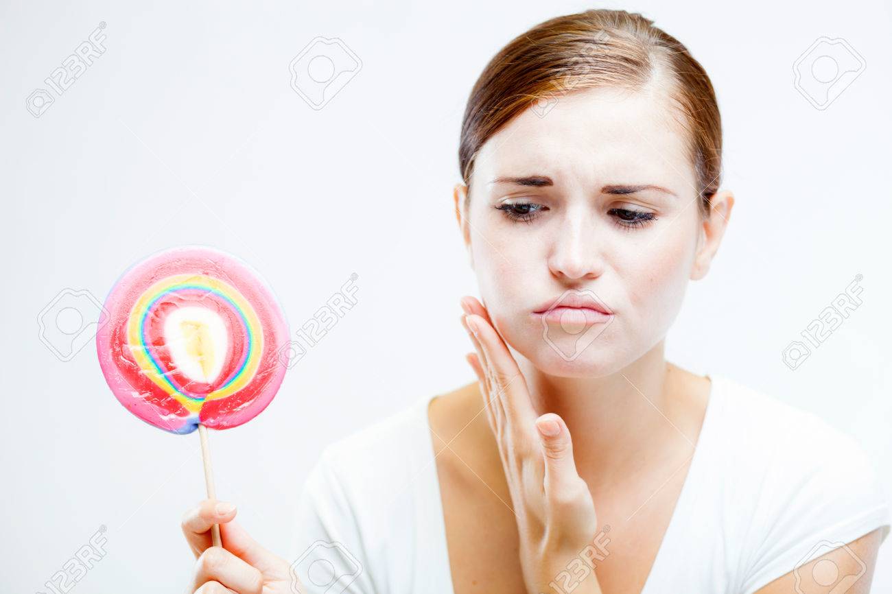Woman Having Toothache After Eating Sweets, Lollipop And Teeth Problem Stock Photo, Picture And Royalty Free Image. Image 31022989.