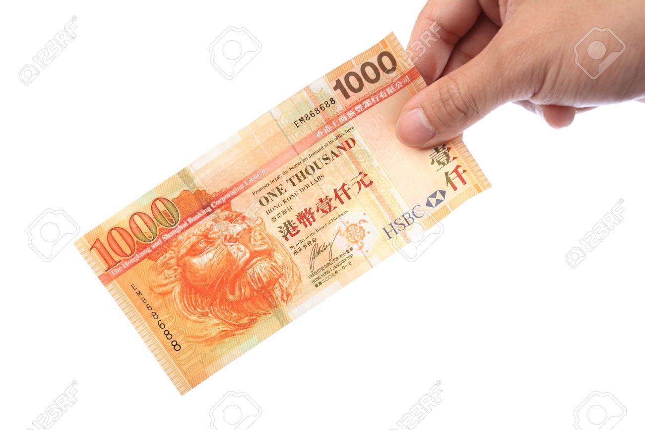 Banknote In Hand, Hong Kong $1000 Banknote Stock Photo, Picture and Royalty  Free Image. Image 7252111.