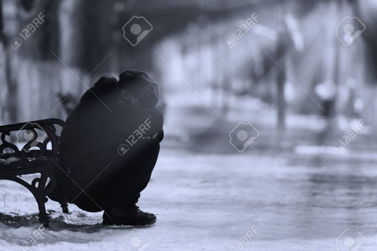 Depressed woman crying in the park in winter. - 46432573 Depressed woman crying in the park in winter. - 46432573