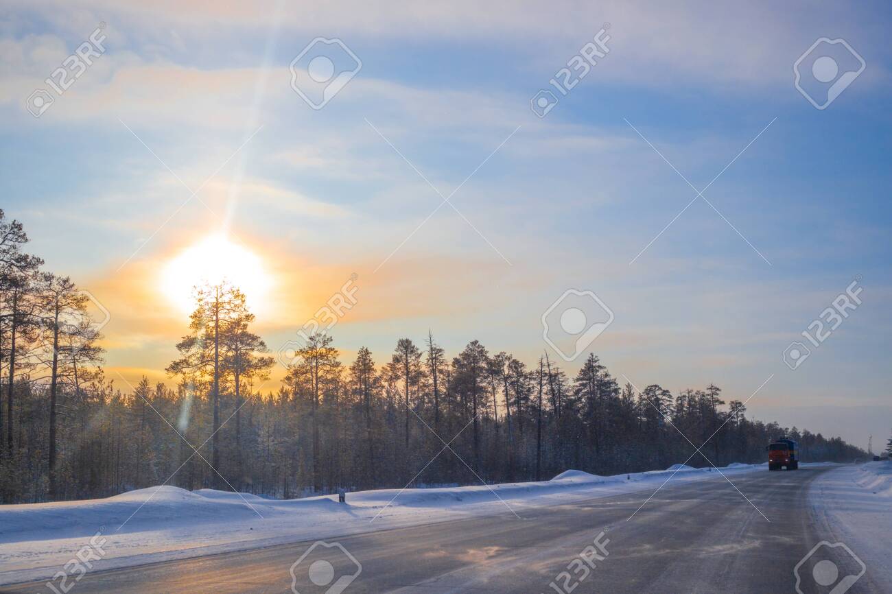 cars ride on a winter road on a sunny day - 139273526 cars ride on a winter road on a sunny day - 139273526