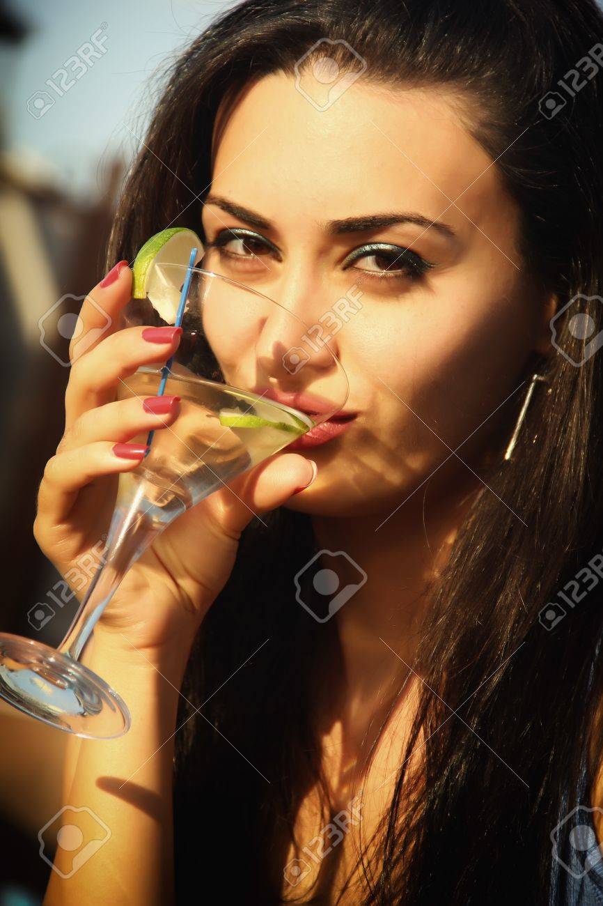 Attractive Young Girl Drinking Martini Stock Photo, Picture And Royalty  Free Image. Image 14366791.