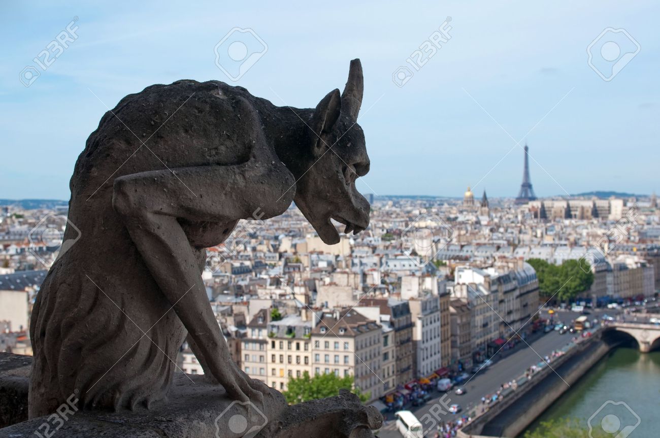 Famous Chimera (demon shape) overlooking the Eiffel Tower from Notre Dame of Paris - 9804101 Famous Chimera (demon shape) overlooking the Eiffel Tower from Notre Dame of Paris - 9804101